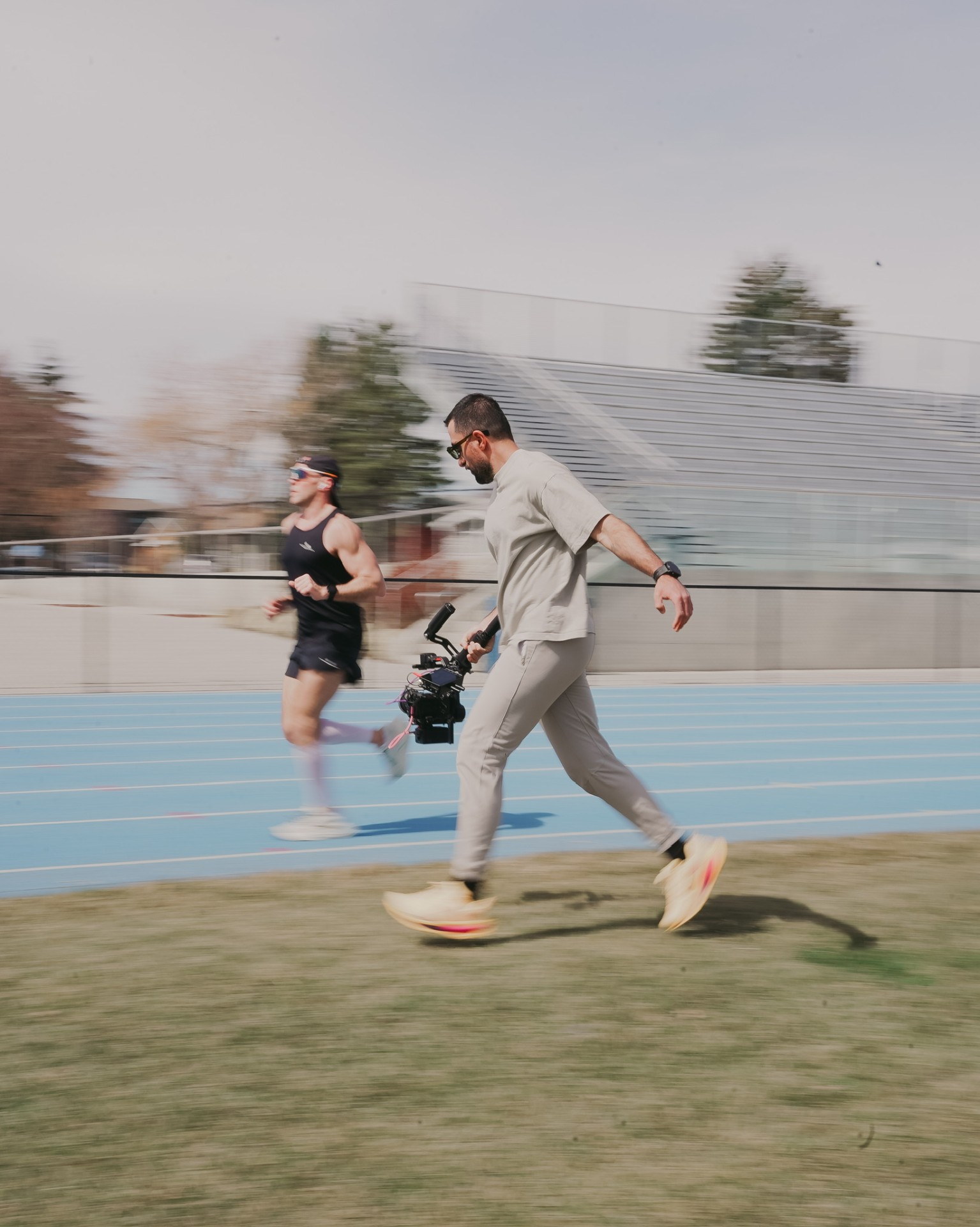 Saad Waseem running alongside an athlete with a gimbal-mounted cinema camera